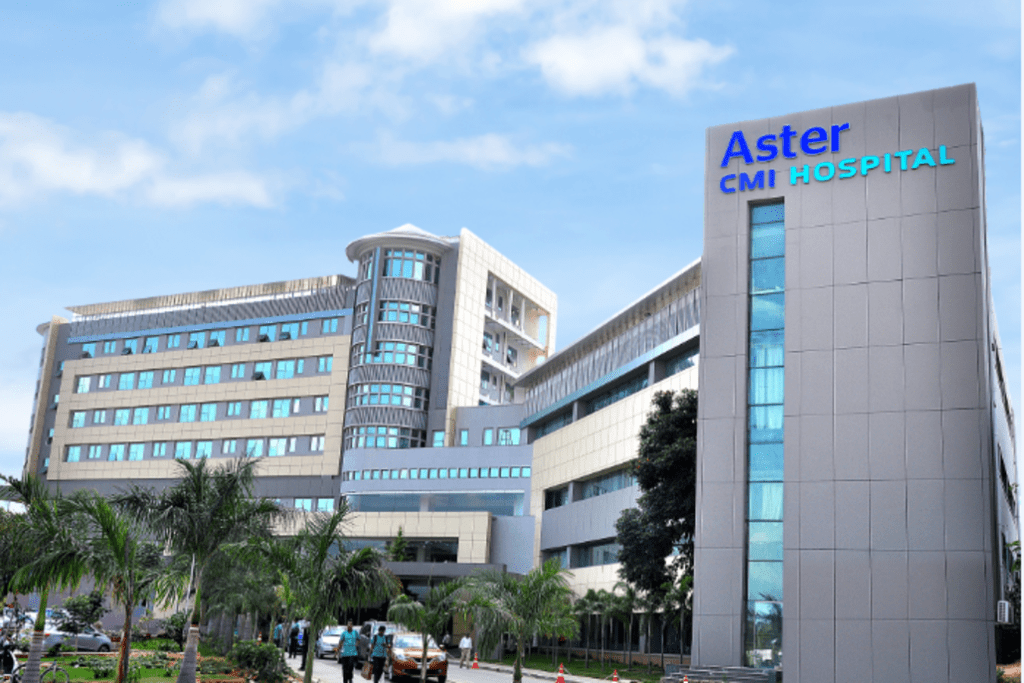 Aster Hospital logo and branding.